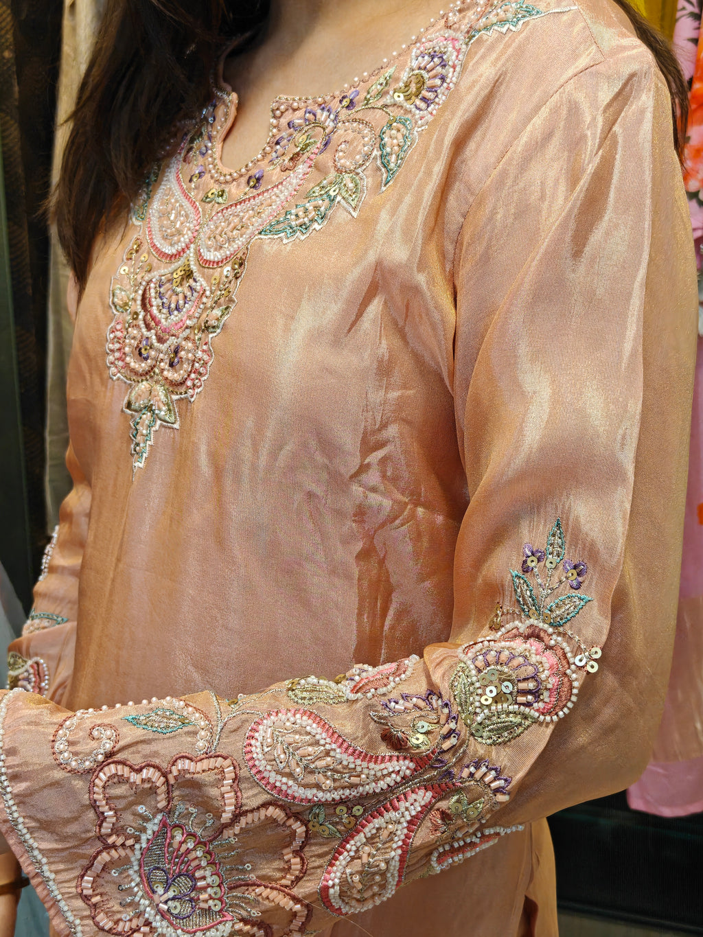Daman embroidery detail of peach tissue palazzo set by Shirisha