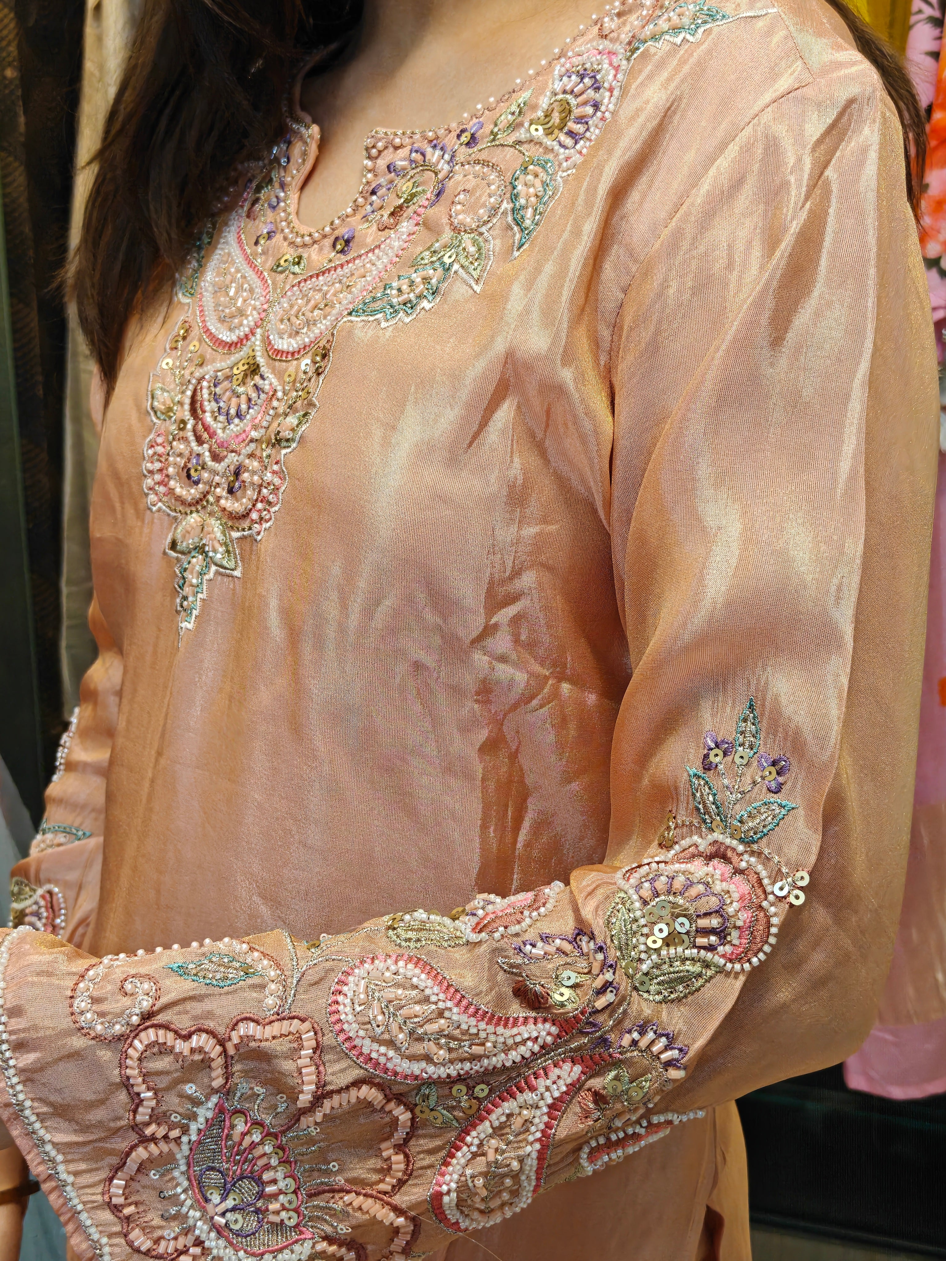 Daman embroidery detail of peach tissue palazzo set by Shirisha