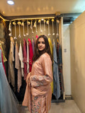 Peach tissue shimmer palazzo set with hand embroidery and pearl work by Shirisha