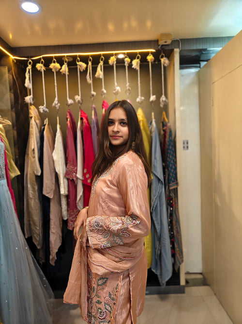 Peach tissue shimmer palazzo set with hand embroidery and pearl work by Shirisha