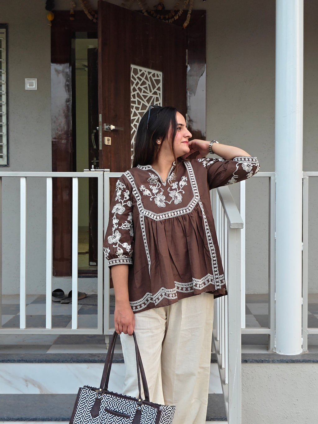 Back view of coffee brown embroidered cotton tunic with intricate thread work